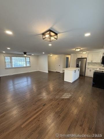 90 Diane Dr, South Windsor, CT 06074 - unfurnished living room with dark wood-style floors, recessed lighting, and a ceiling fan