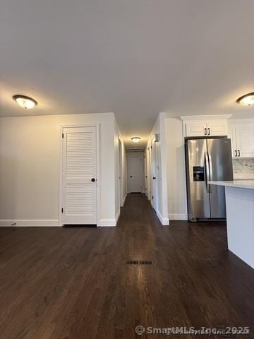 90 Diane Dr, South Windsor, CT 06074 - kitchen with stainless steel refrigerator with ice dispenser, dark wood-style floors, light countertops, and white cabinets