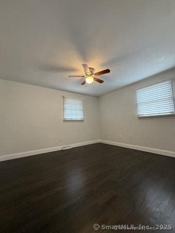 90 Diane Dr, South Windsor, CT 06074 - spare room with dark wood-style floors and a ceiling fan