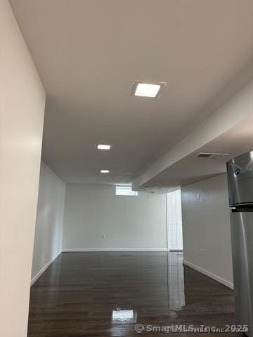 90 Diane Dr, South Windsor, CT 06074 - finished below grade area with dark wood-style flooring and freestanding refrigerator