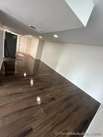 90 Diane Dr, South Windsor, CT 06074 - empty room featuring dark wood-style floors and recessed lighting