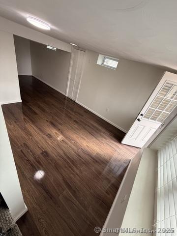 90 Diane Dr, South Windsor, CT 06074 - basement with wood finished floors and baseboards