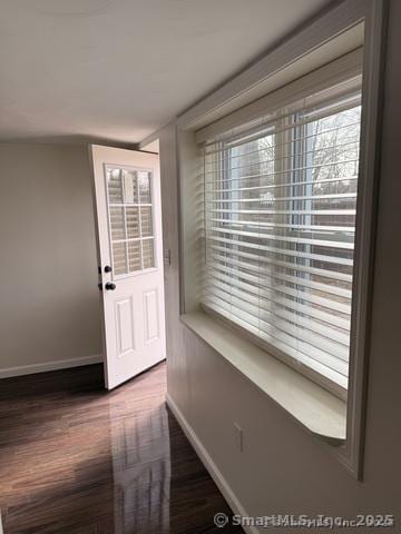90 Diane Dr, South Windsor, CT 06074 - doorway to outside featuring baseboards and dark wood-style flooring