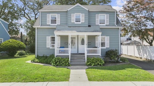 19 Plymouth Ave, Norwalk, CT 06851 - view of front of property featuring a porch, roof with shingles, and driveway