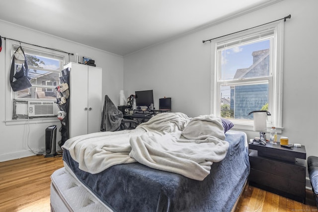 19 Plymouth Ave, Norwalk, CT 06851 - bedroom featuring wood finished floors, crown molding, cooling unit, and a desk