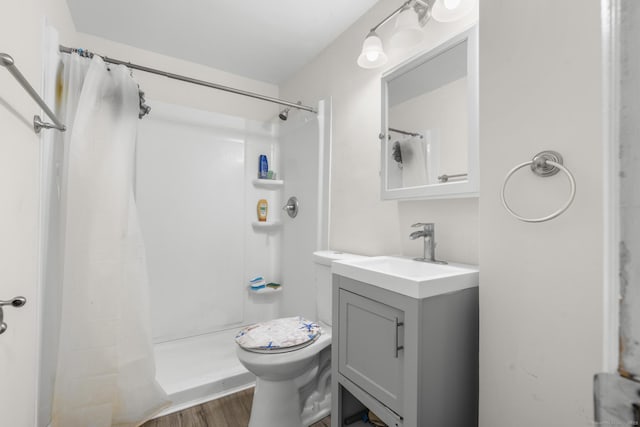 19 Plymouth Ave, Norwalk, CT 06851 - bathroom with vanity, a shower with shower curtain, and wood finished floors