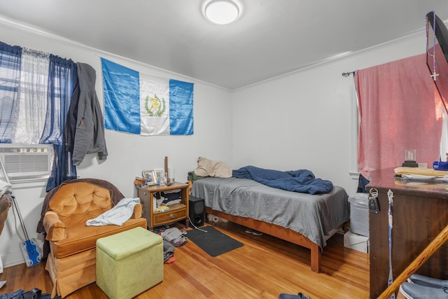 19 Plymouth Ave, Norwalk, CT 06851 - bedroom with wood finished floors, crown molding, and cooling unit