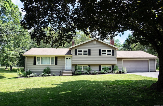 7 Derenthal Dr, Madison, CT 06443 - tri-level home with a chimney, a front lawn, a garage, concrete driveway, and entry steps