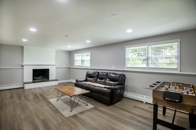 7 Derenthal Dr, Madison, CT 06443 - living area featuring a baseboard radiator, recessed lighting, wood finished floors, and a fireplace