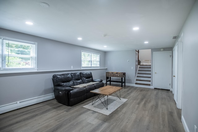 7 Derenthal Dr, Madison, CT 06443 - living area with a baseboard heating unit, stairs, wood finished floors, and recessed lighting