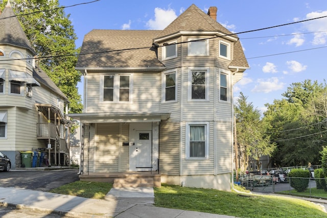 78 Pine St, Waterbury, CT 06710 - victorian house featuring a chimney and roof with shingles