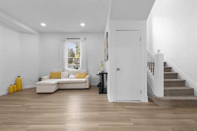 78 Pine St, Waterbury, CT 06710 - living area featuring light wood finished floors, stairs, and recessed lighting