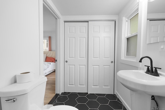 78 Pine St, Waterbury, CT 06710 - half bathroom featuring ensuite bath and tile patterned floors
