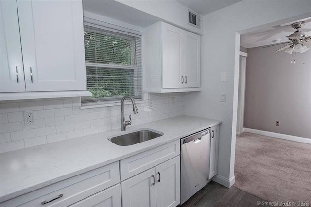 29 Van Buren Ave Unit H7, Norwalk, CT 06850 - kitchen with stainless steel dishwasher, white cabinetry, tasteful backsplash, a ceiling fan, and dark wood finished floors