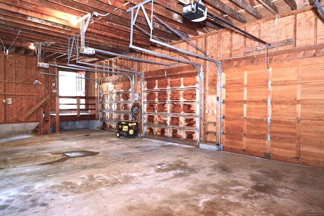 67 Transylvania Rd, Roxbury, CT 06783 - garage with a garage door opener and wooden walls