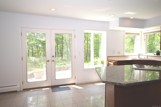 67 Transylvania Rd, Roxbury, CT 06783 - doorway featuring healthy amount of natural light, french doors, light tile patterned floors, baseboard heating, and recessed lighting