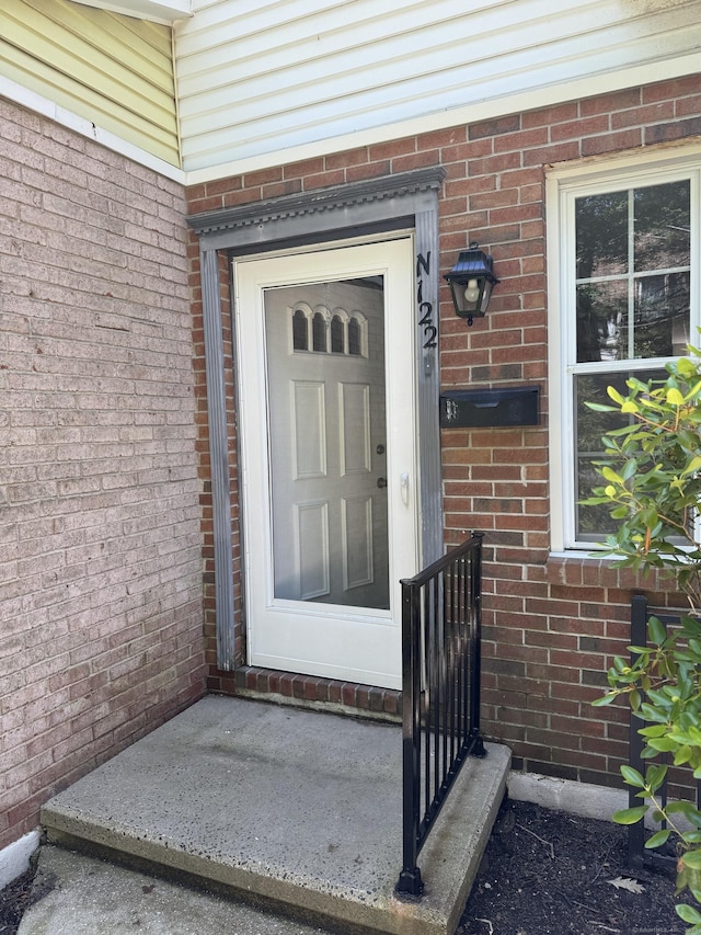 122 Queens Rd Unit 122, Torrington, CT 06790 - doorway to property with brick siding