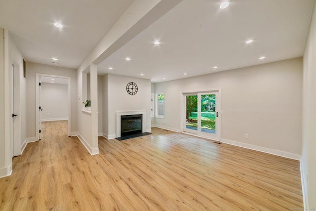12 Boulevard Dr Unit 27-157, Danbury, CT 06810 - unfurnished living room featuring light wood finished floors, recessed lighting, and a fireplace with flush hearth