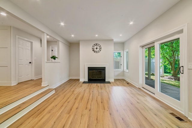 12 Boulevard Dr Unit 27-157, Danbury, CT 06810 - unfurnished living room with wood finished floors, recessed lighting, and a fireplace with flush hearth