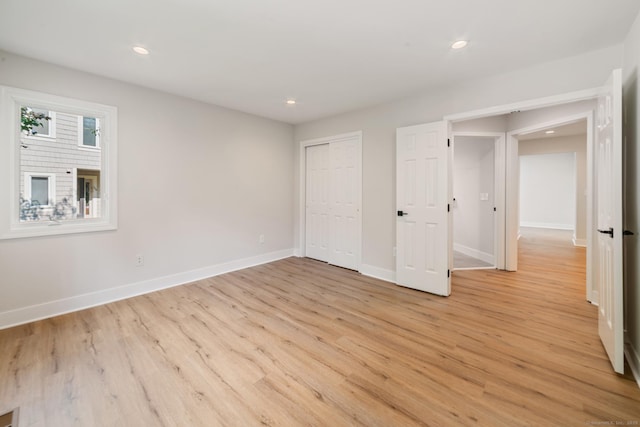 12 Boulevard Dr Unit 27-157, Danbury, CT 06810 - unfurnished bedroom with light wood-style floors, recessed lighting, and a closet