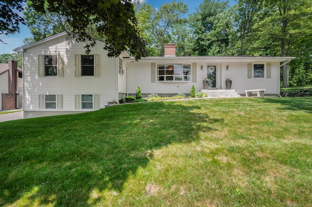 117 Woodfield Rd, Bristol, CT 06010 - view of front of house featuring a front lawn and a chimney