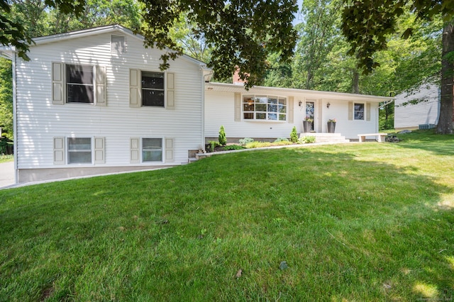 117 Woodfield Rd, Bristol, CT 06010 - tri-level home featuring a front lawn and a chimney