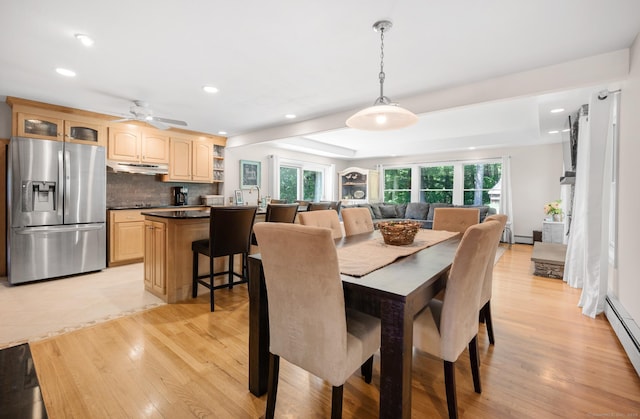 117 Woodfield Rd, Bristol, CT 06010 - dining area featuring light wood-type flooring, recessed lighting, a baseboard heating unit, a raised ceiling, and ceiling fan