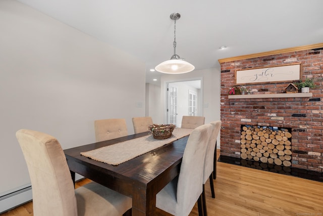 117 Woodfield Rd, Bristol, CT 06010 - dining space featuring a baseboard heating unit, light wood-style flooring, and recessed lighting