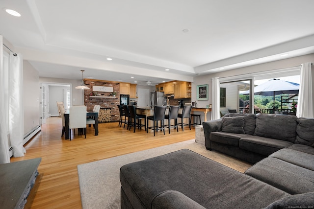 117 Woodfield Rd, Bristol, CT 06010 - living room featuring recessed lighting, light wood finished floors, a baseboard heating unit, and a raised ceiling