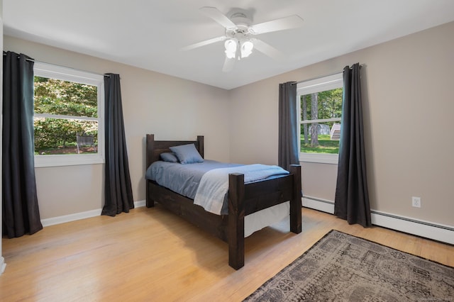 117 Woodfield Rd, Bristol, CT 06010 - bedroom featuring light wood-style flooring, a baseboard heating unit, and ceiling fan