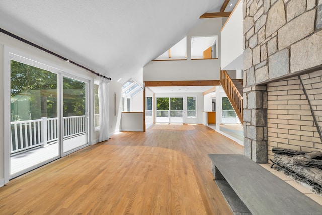 11 Island Bay Cir, Guilford, CT 06437 - unfurnished living room with wood finished floors, healthy amount of natural light, and high vaulted ceiling