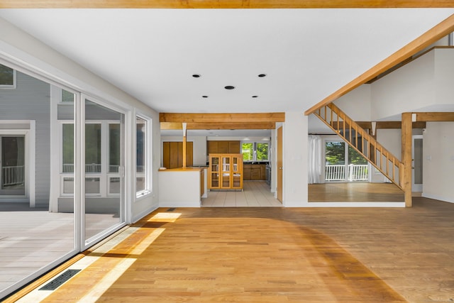 11 Island Bay Cir, Guilford, CT 06437 - unfurnished living room featuring light wood-type flooring, recessed lighting, french doors, and stairs