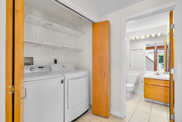 11 Island Bay Cir, Guilford, CT 06437 - washroom with washing machine and dryer and light tile patterned flooring