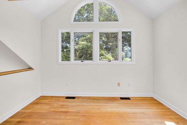 11 Island Bay Cir, Guilford, CT 06437 - unfurnished room featuring lofted ceiling and wood finished floors