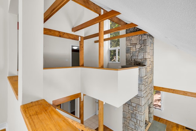 11 Island Bay Cir, Guilford, CT 06437 - staircase with a textured ceiling and wood finished floors