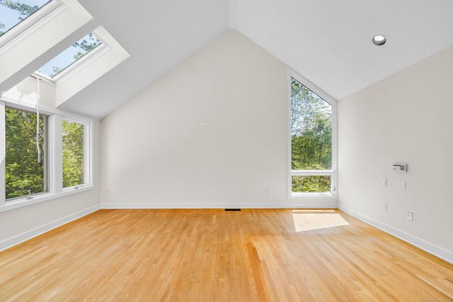 11 Island Bay Cir, Guilford, CT 06437 - bonus room featuring a skylight, vaulted ceiling, and wood finished floors