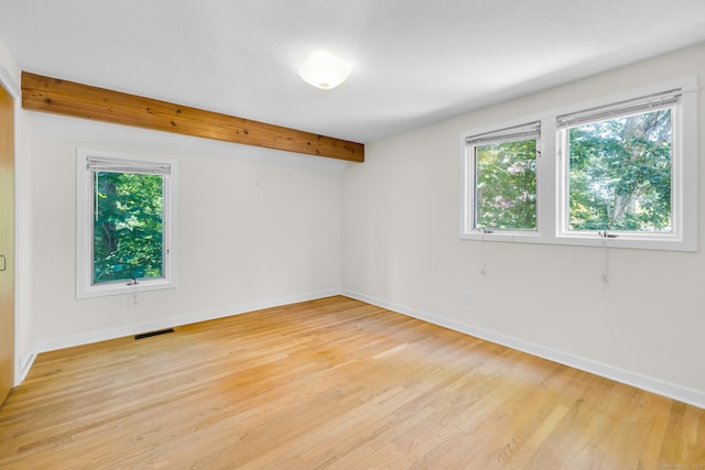 11 Island Bay Cir, Guilford, CT 06437 - spare room featuring light wood-type flooring and beam ceiling