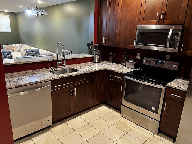 132 Maple Ave Unit B, Hartford, CT 06114 - kitchen featuring appliances with stainless steel finishes, light tile patterned floors, and light stone countertops