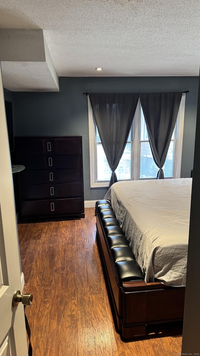 132 Maple Ave Unit B, Hartford, CT 06114 - bedroom with a textured ceiling and wood finished floors