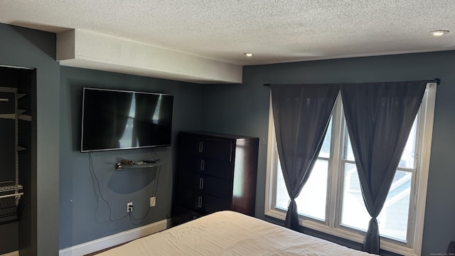 132 Maple Ave Unit B, Hartford, CT 06114 - bedroom with a textured ceiling and baseboards