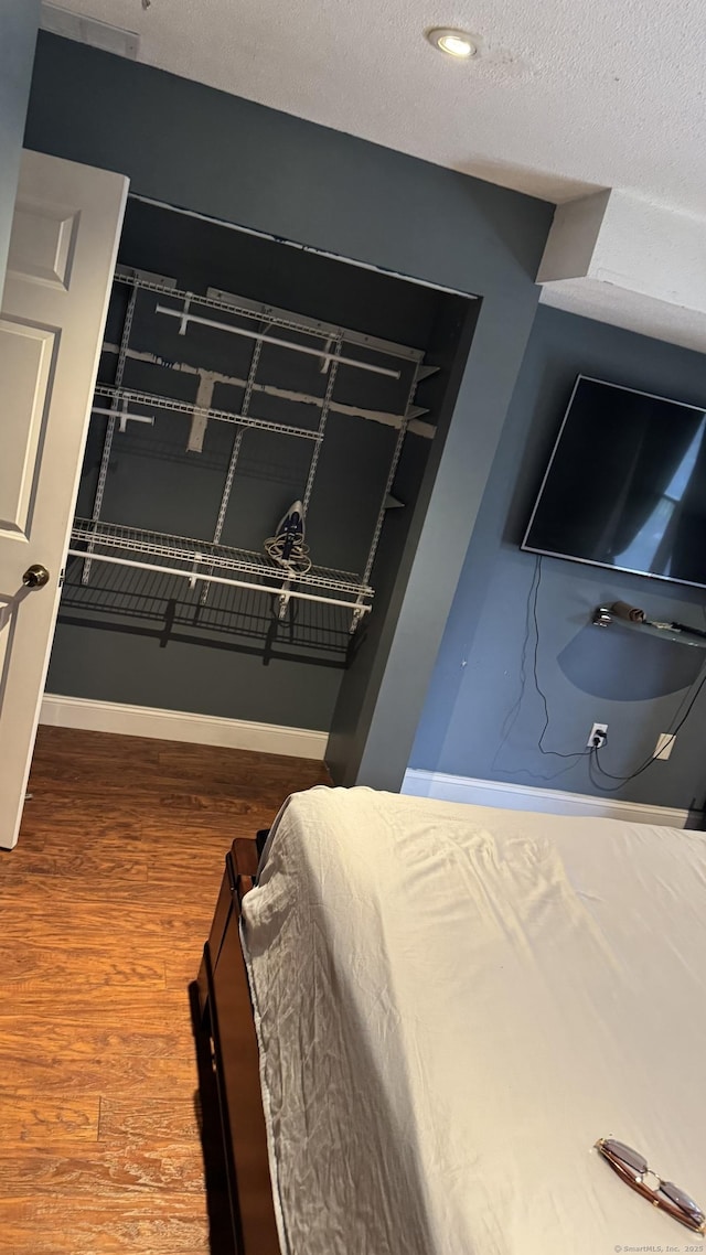 132 Maple Ave Unit B, Hartford, CT 06114 - bedroom with wood finished floors and a textured ceiling