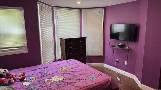 132 Maple Ave Unit B, Hartford, CT 06114 - bedroom with wood finished floors and a textured ceiling