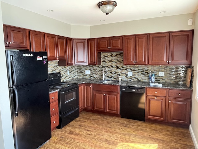 27 Bayview Pl Apt 5, West Haven, CT 06516 - kitchen featuring black appliances, light wood-style flooring, and tasteful backsplash