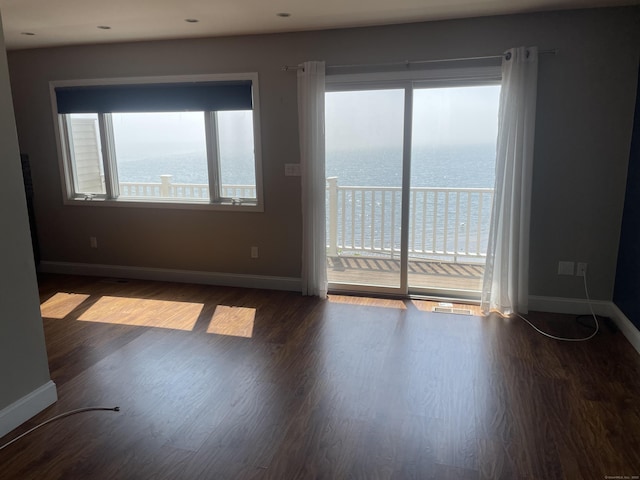 27 Bayview Pl Apt 5, West Haven, CT 06516 - unfurnished room with wood finished floors and a water view