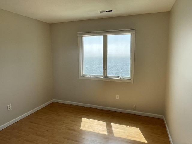 27 Bayview Pl Apt 5, West Haven, CT 06516 - unfurnished room with wood finished floors and baseboards
