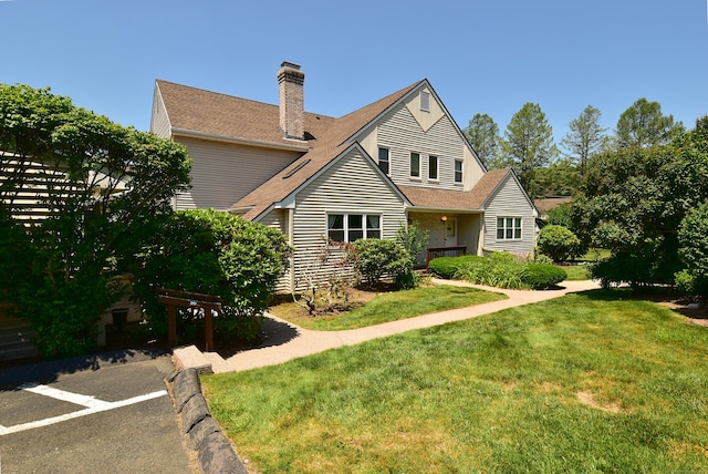 11 Thistle Way Apt D, East Windsor, CT 06016 - view of front of house with a front yard, a chimney, and roof with shingles