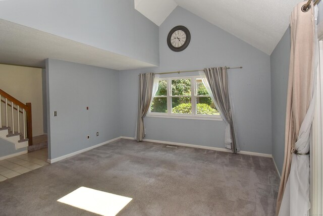 11 Thistle Way Apt D, East Windsor, CT 06016 - spare room with stairway, carpet floors, and high vaulted ceiling