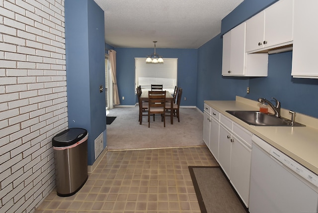 11 Thistle Way Apt D, East Windsor, CT 06016 - kitchen with dishwasher, a chandelier, light countertops, white cabinets, and carpet floors