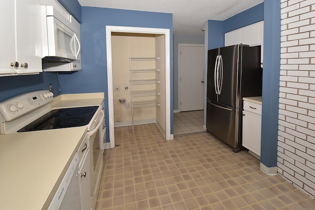 11 Thistle Way Apt D, East Windsor, CT 06016 - kitchen featuring white appliances, light countertops, white cabinetry, light flooring, and a textured ceiling