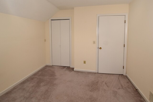 11 Thistle Way Apt D, East Windsor, CT 06016 - unfurnished bedroom featuring carpet floors, vaulted ceiling, and a closet